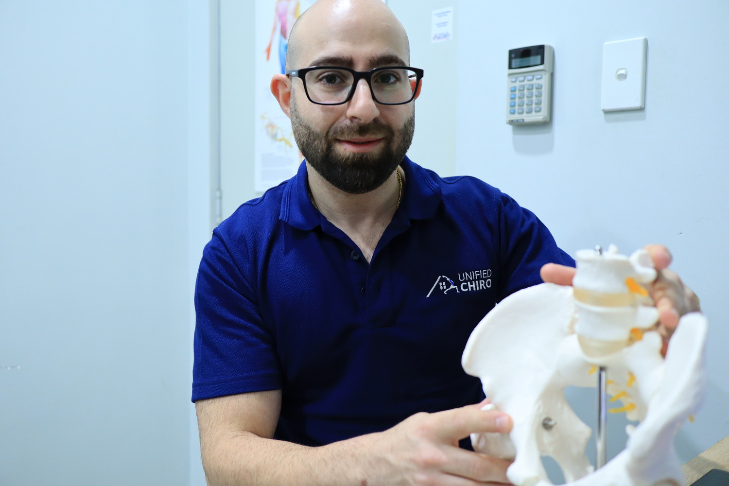 Joseph Bitar with spine anatomy model